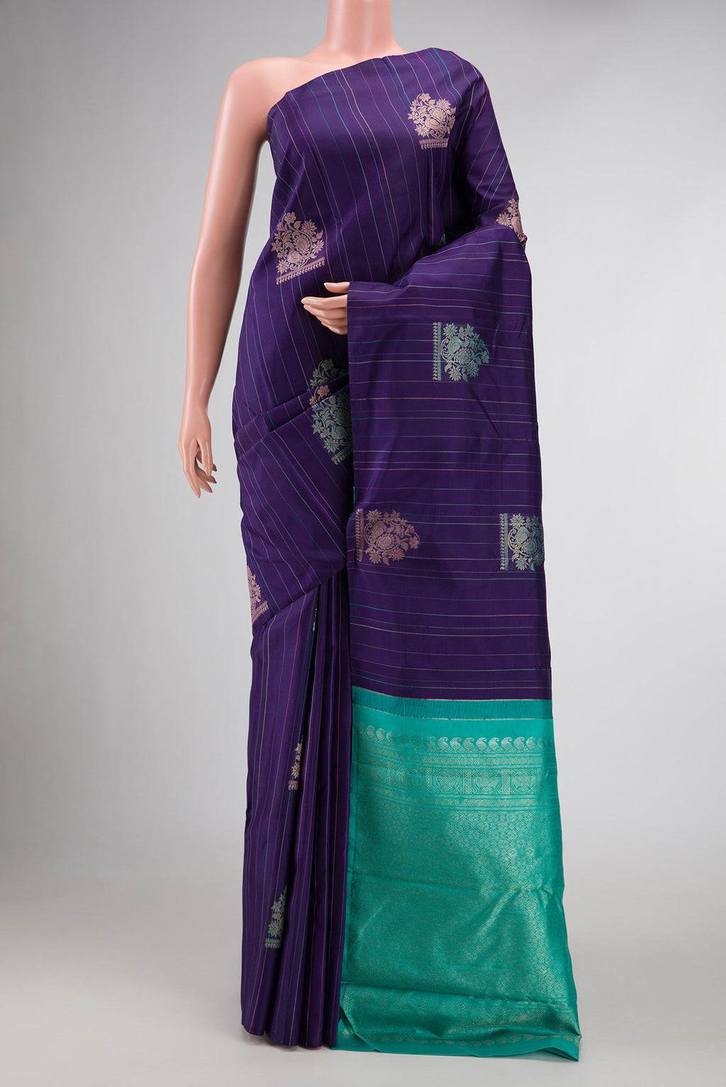 Pure Silk Pure Zari Navy Blue Dual Tone Kanchipuram Saree with Stripes on the body and Without Border displayed on a mannequin