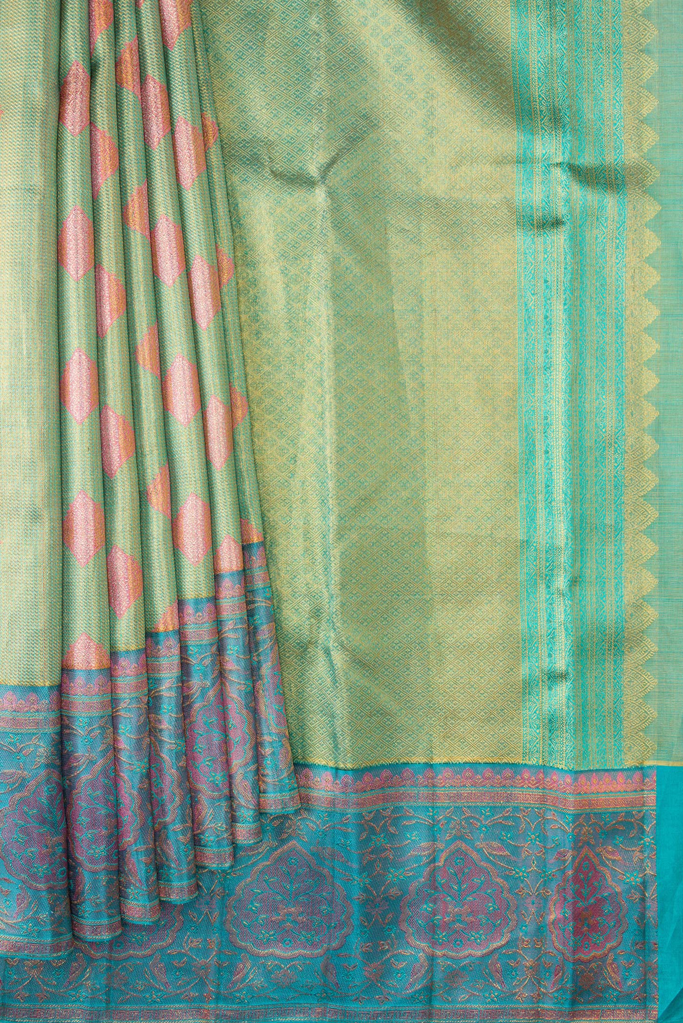 Pleats and pallu of Green Dual Tone Kanjivaram Tissue Silk Saree with Zari Brocade on the body and Fancy Border. 
