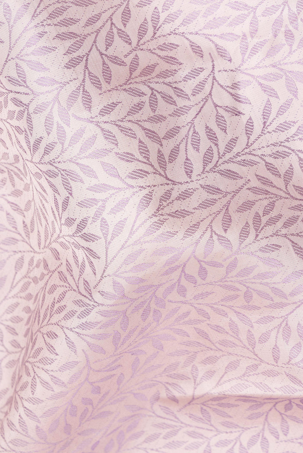 Close up of Pure Silk Golden Peach Kanchipuram Saree with Jacquard design on the body and Fancy Border.  displaying folds