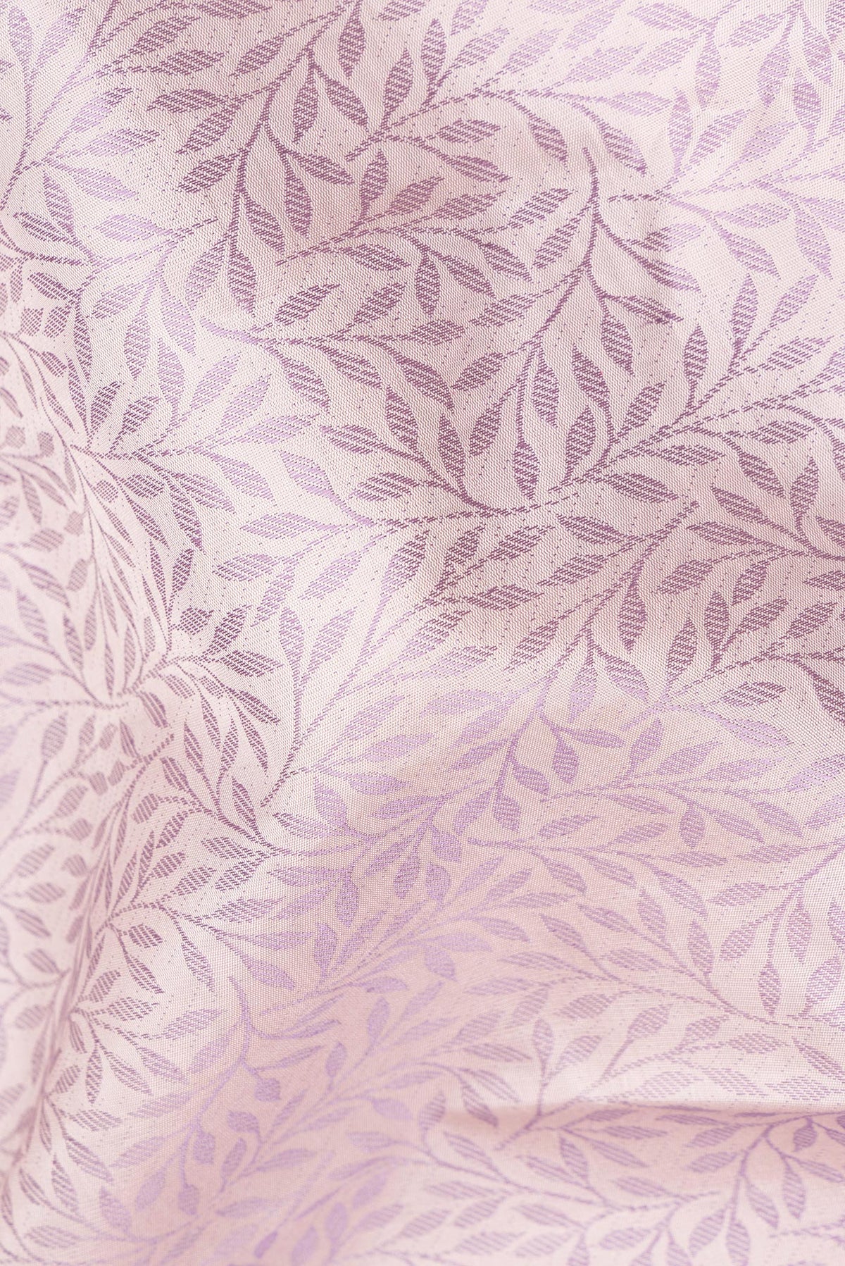Close up of Pure Silk Golden Peach Kanchipuram Saree with Jacquard design on the body and Fancy Border.  displaying folds