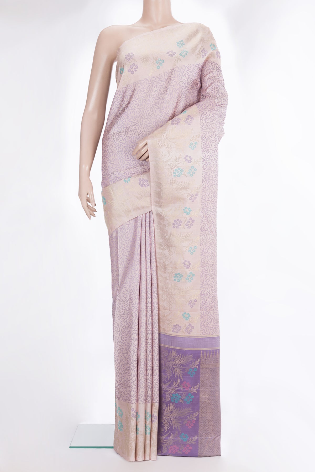 Pure Silk Golden Peach Kanchipuram Saree with Jacquard design on the body and Fancy Border.  displayed on a mannequin