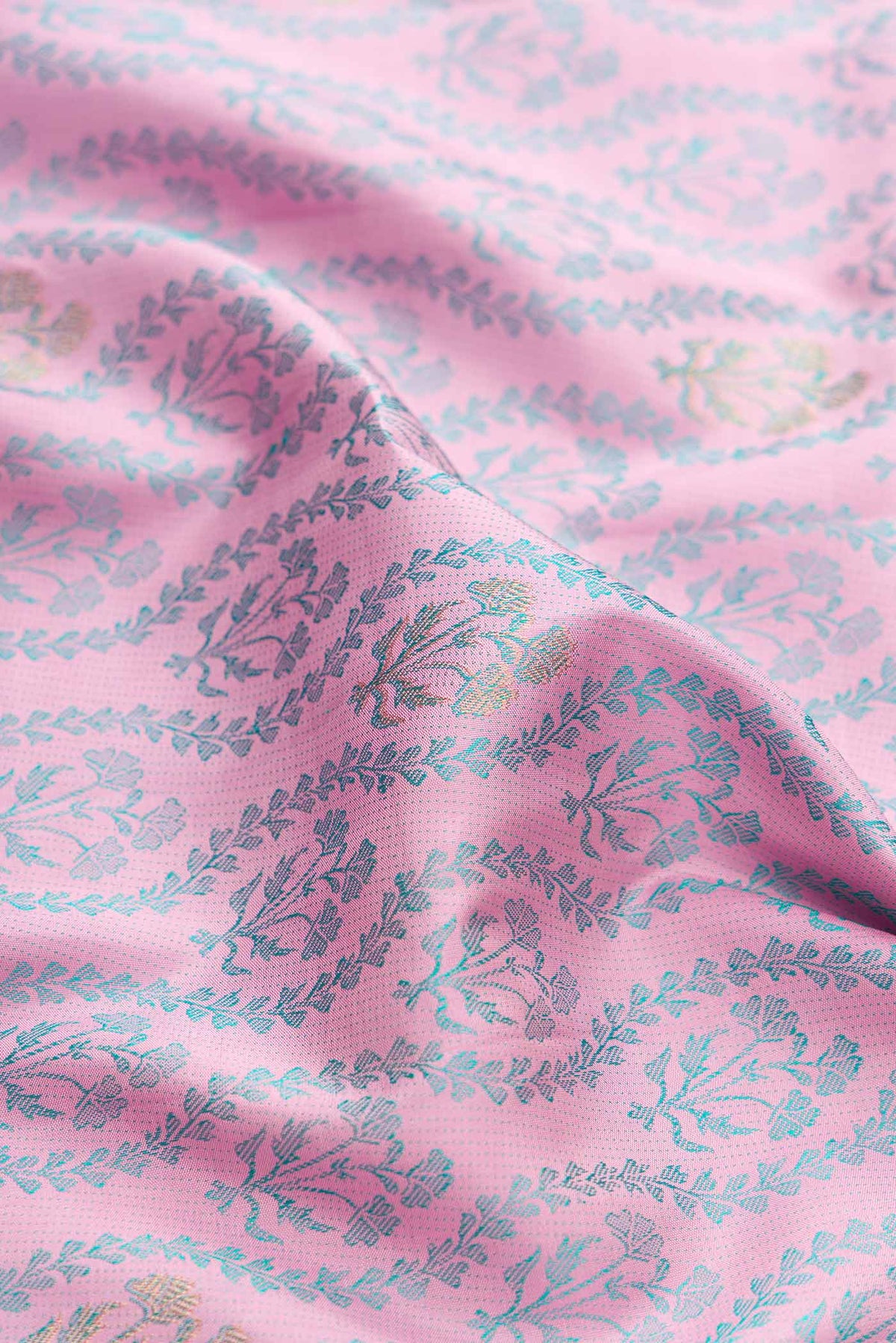 Close up of Pure Silk Pure Zari Pink Dual Tone Kanchipuram Saree with Jacquard design on the body and Fancy Border displaying folds