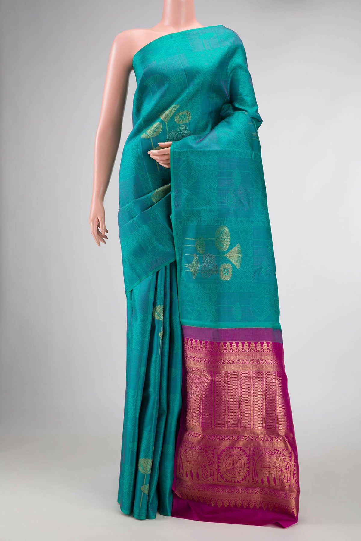 Sea Green Dual Tone Kanchipuram Silk Saree with Jacquard With Zari Butta on the body and Without Border displayed on a mannequin