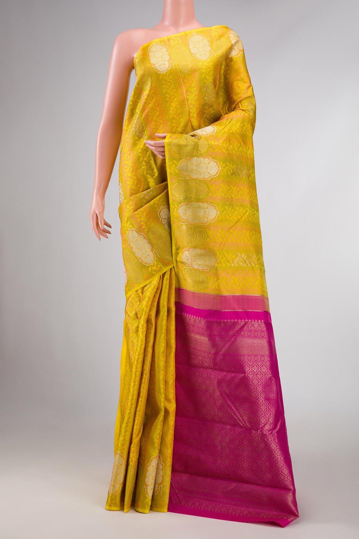 Yellow Dual Tone Kanchipuram Silk Saree with Jacquard design on the body and Fancy Border displayed on a mannequin