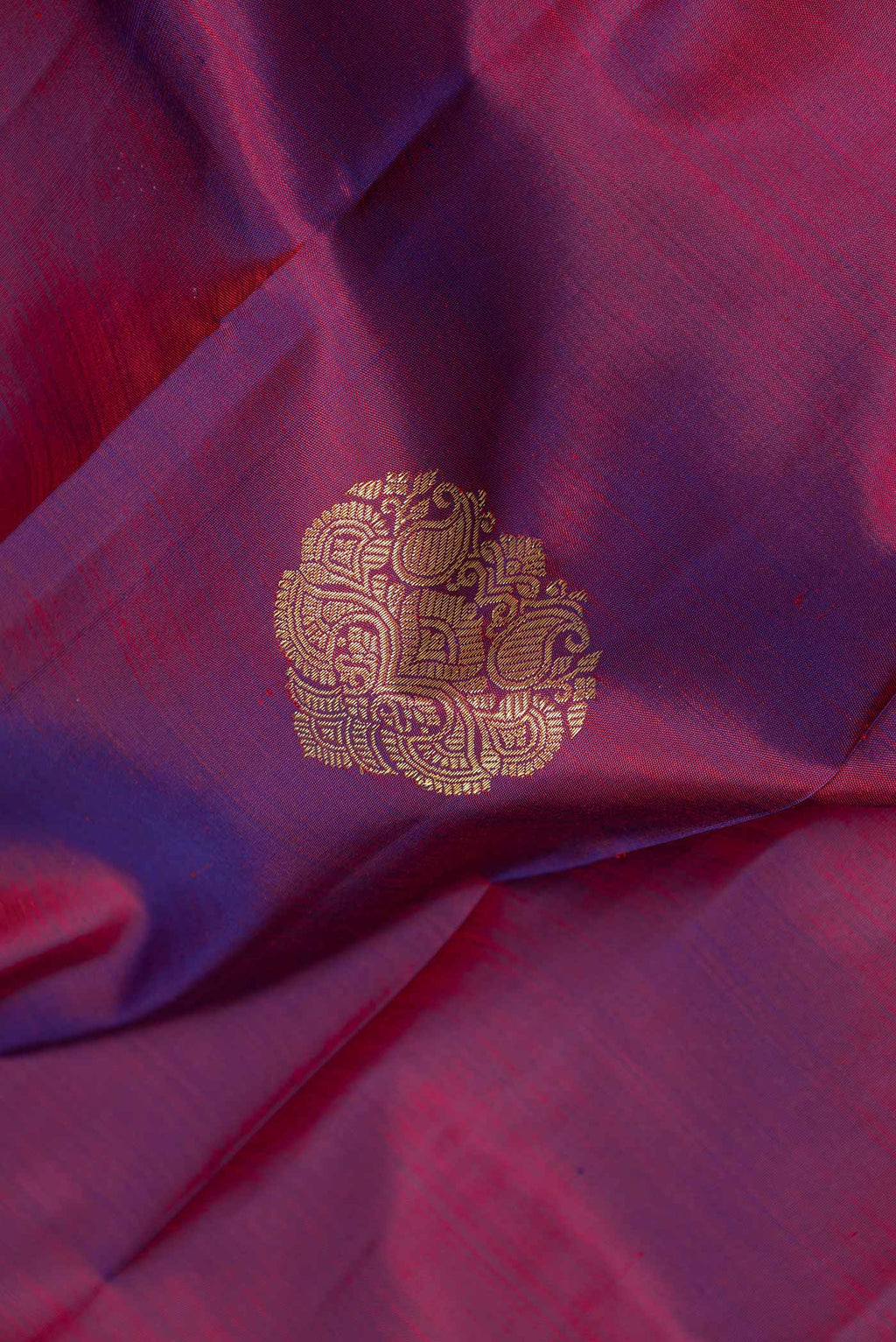 Close up of Purple Dual Tone Kanchipuram Silk Saree with Zari Butta on the body and Zari Border displaying folds