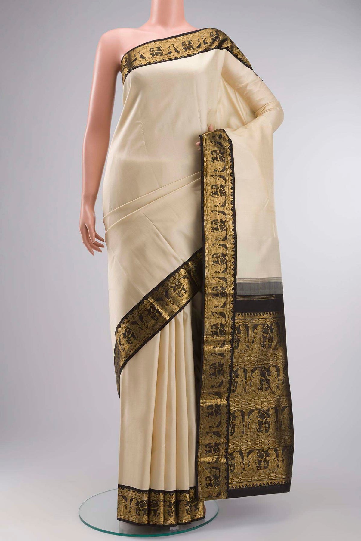 Beige Kanchipuram Silk Saree with Plain Body and Zari Border displayed on a mannequin