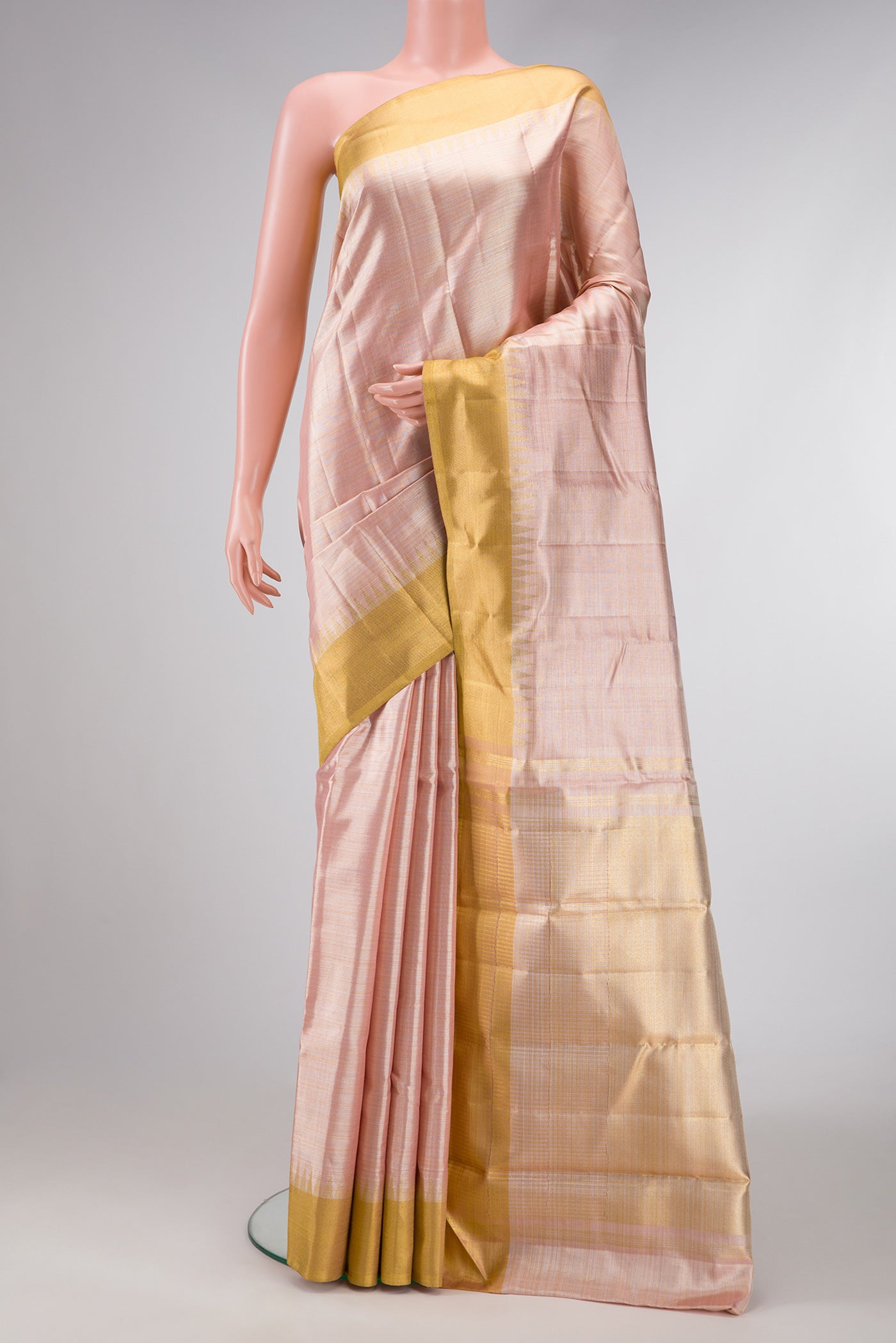 Rose Gold Dual Tone Kanjivaram Tissue Silk Saree with Plain Body and Temple Border.  displayed on a mannequin