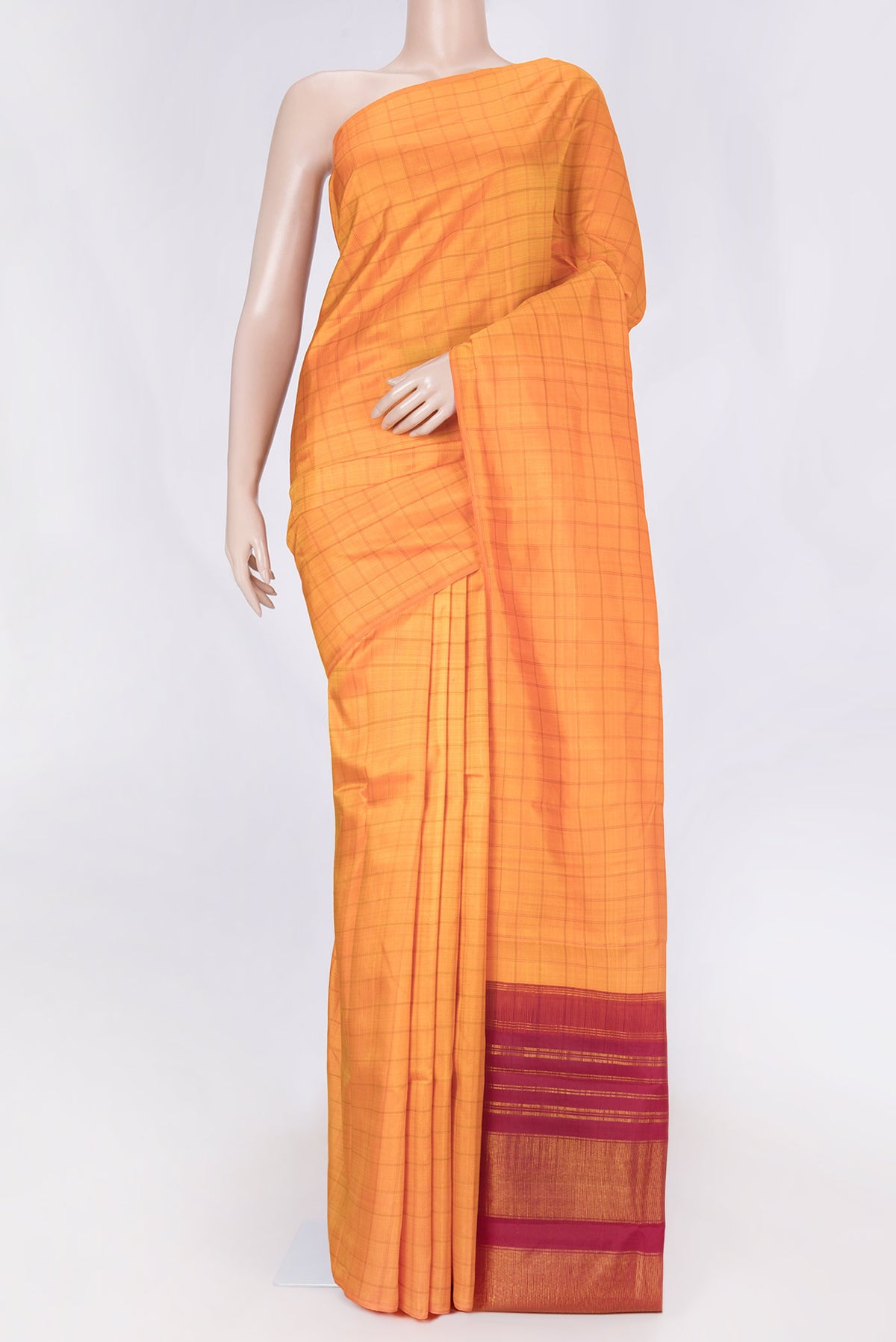 Orange Dual Tone Kanchipuram Saree with Checked design on the body and Without Border displayed on a mannequin