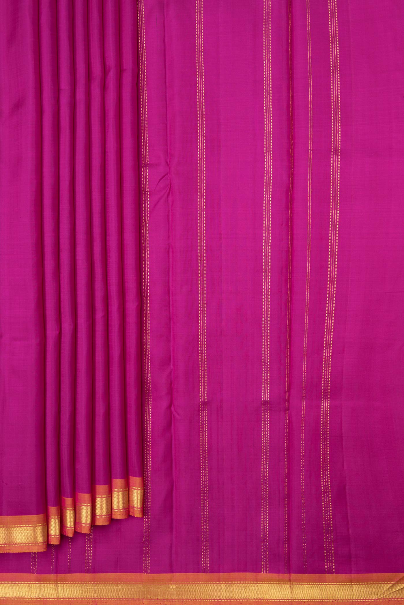 Pleats and pallu of Magenta Dual Tone Kanjivaram Saree with Plain Body and Zari Border. 