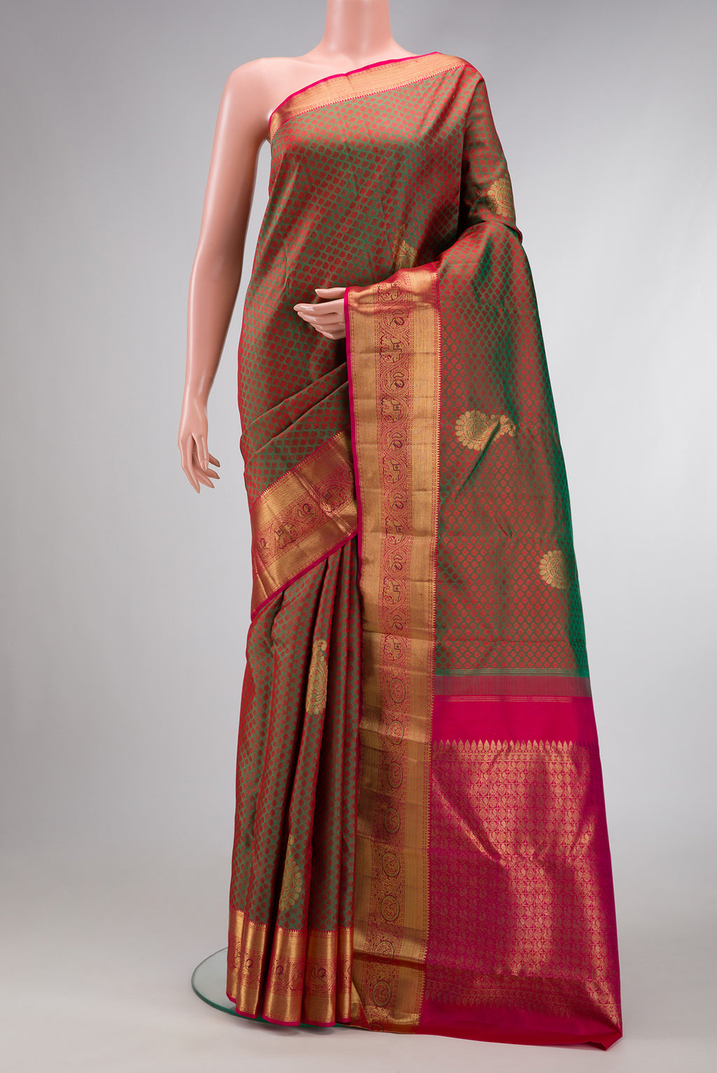 Mehandi Green Dual Tone Kanchipuram Silk Saree with Jacquard With Zari Butta on the body and Zari Border.  displayed on a mannequin