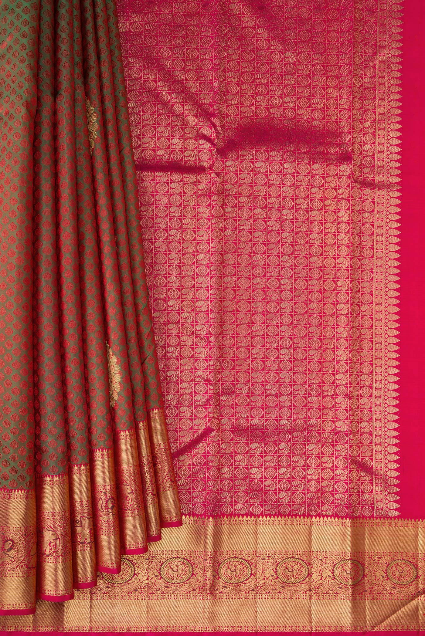 Pleats and pallu of Mehandi Green Dual Tone Kanchipuram Silk Saree with Jacquard With Zari Butta on the body and Zari Border. 