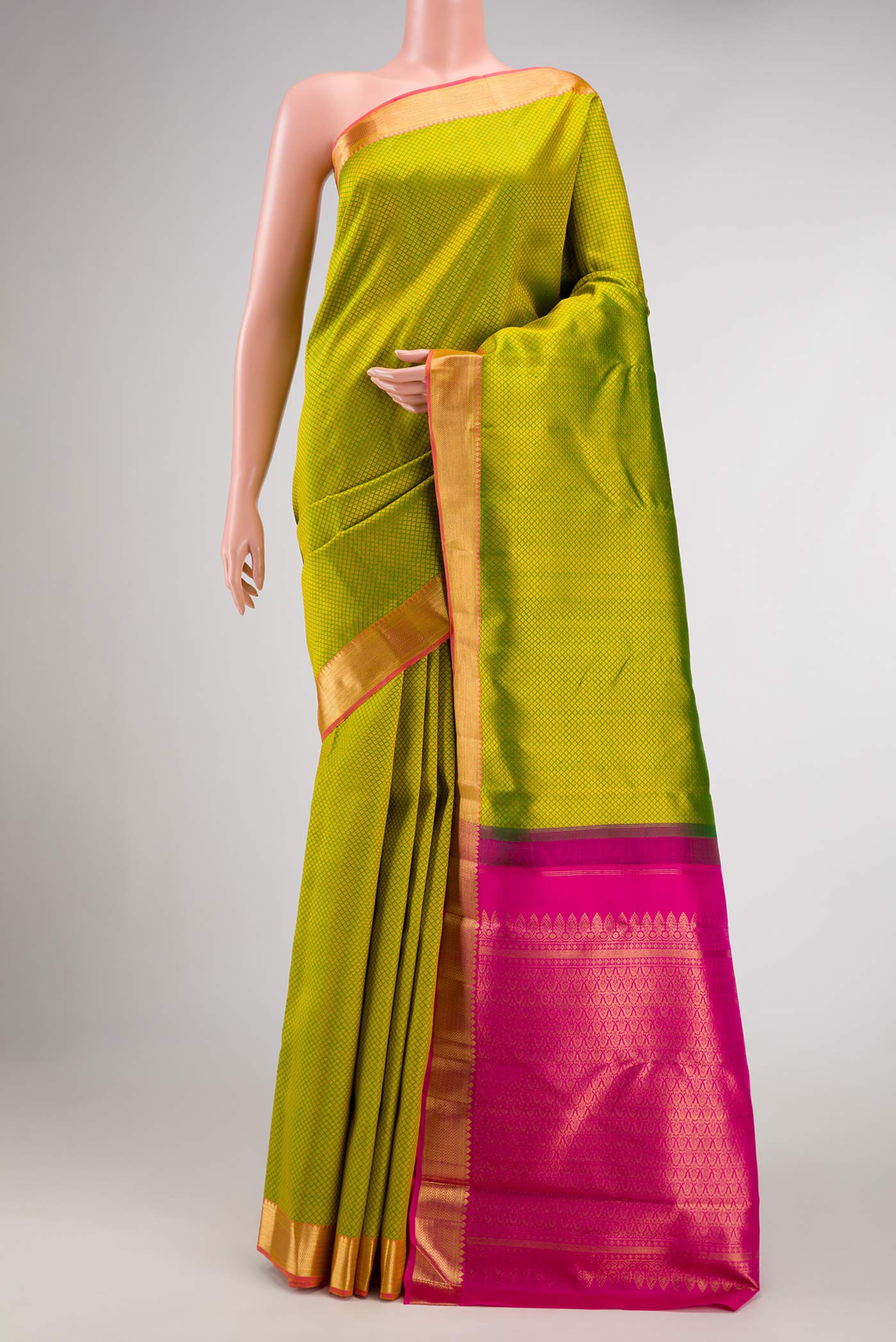 Pure Silk Pure Zari Parrot Green Dual Tone Kanjivaram Saree with Jacquard design on the body and Zari Border.  displayed on a mannequin