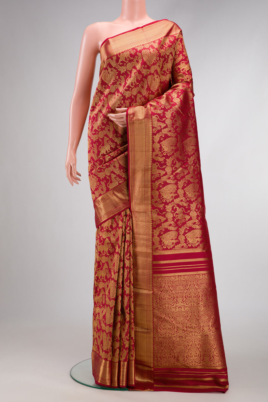 Maroon Dual Tone Kanchipuram Silk Saree with Zari Brocade on the body and Zari Border.  displayed on a mannequin