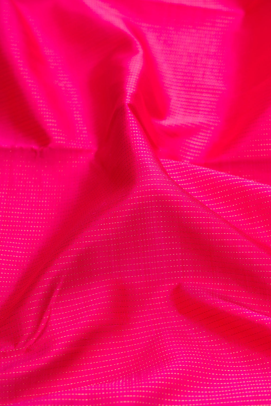 Close up of Pure Silk Pure Zari Dark Pink Dual Tone Kanchipuram Saree with Zari Butta on the body and Zari Border.  displaying folds