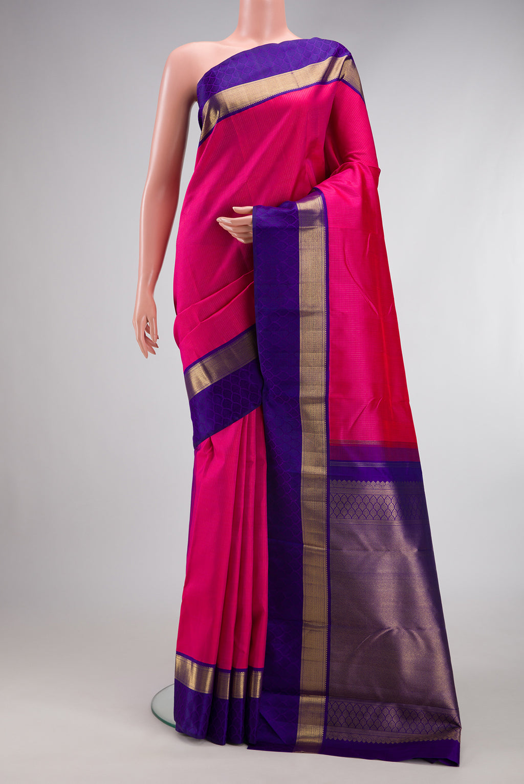 Pure Silk Pure Zari Dark Pink Dual Tone Kanchipuram Saree with Zari Butta on the body and Zari Border.  displayed on a mannequin