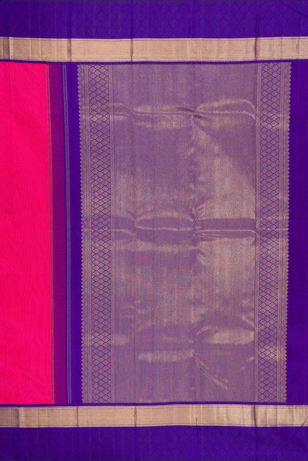Close up image of the pallu of Pure Silk Pure Zari Dark Pink Dual Tone Kanchipuram Saree with Zari Butta on the body and Zari Border. 