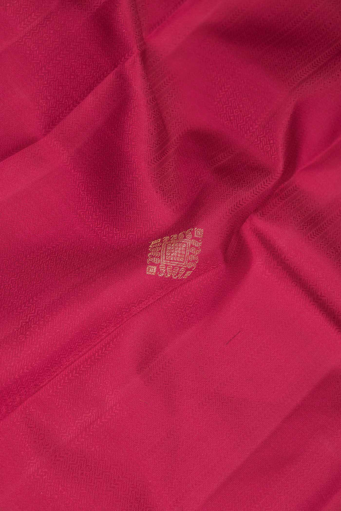 Close up of Pure Silk Pure Zari Pink Dual Tone Kanchipuram Saree with Jacquard With Zari Butta on the body and Zari Border displaying folds