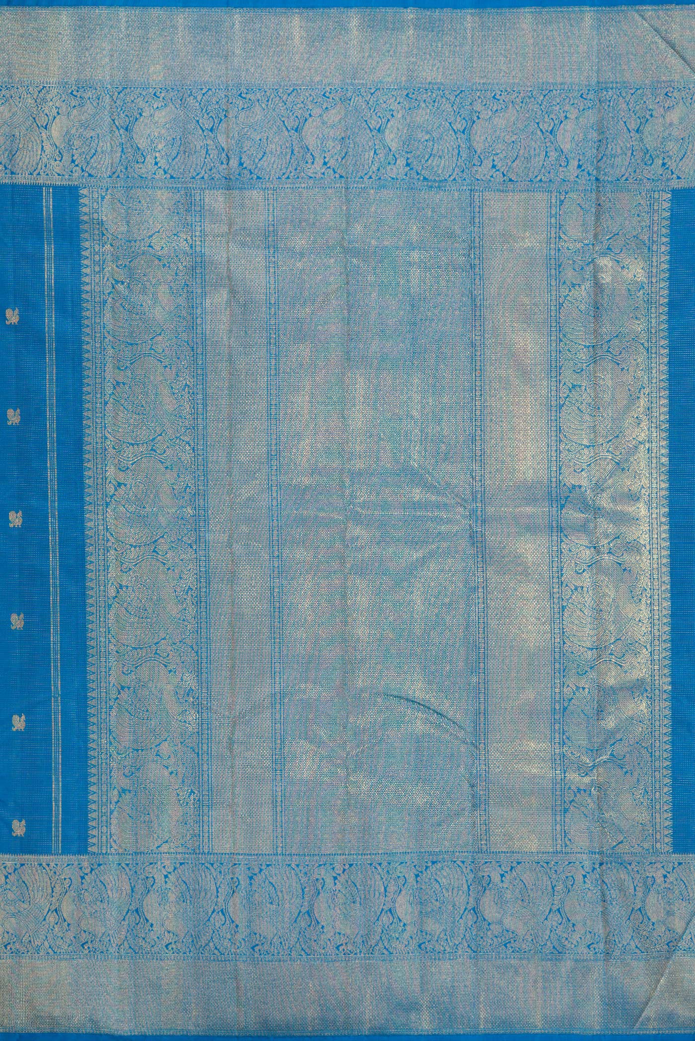 Close up image of the pallu of Pure Silk Pure Zari Peacock Blue Kanjivaram Saree with Zari Butta on the body and Zari Border. 