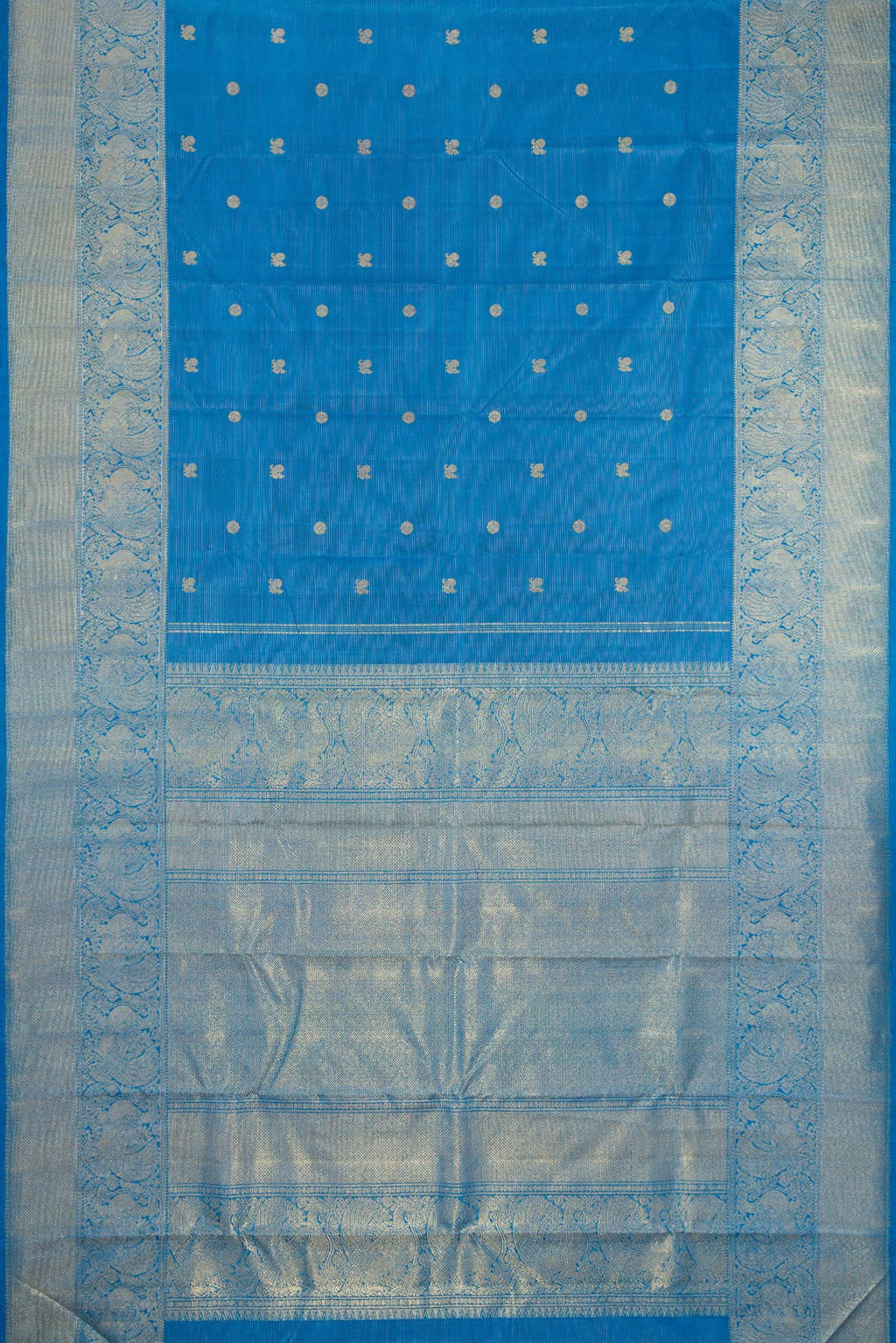 Flat view of Pure Silk Pure Zari Peacock Blue Kanjivaram Saree with Zari Butta on the body and Zari Border. 