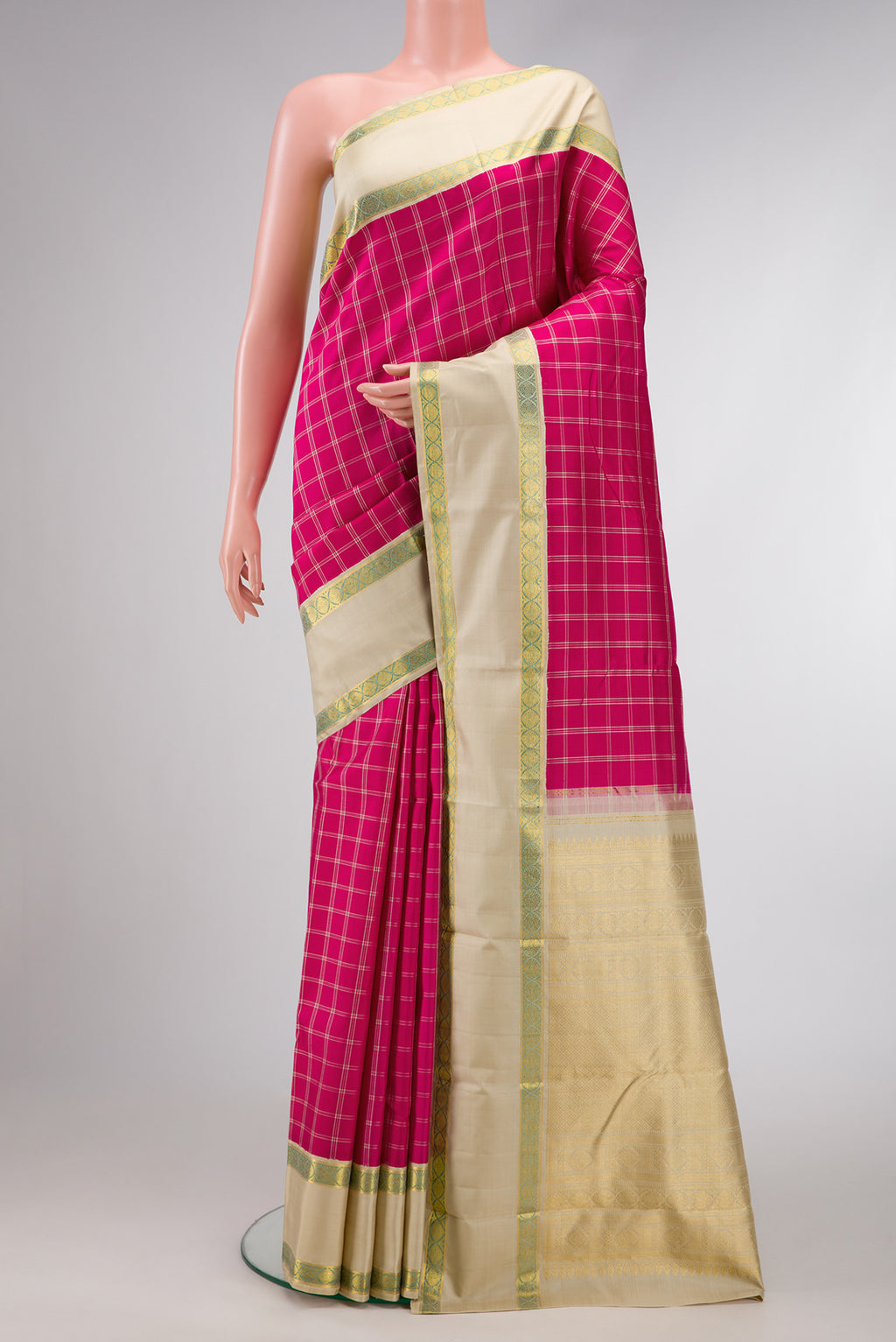 Pink Dual Tone Kanjivaram Silk Saree with Checked design on the body and Zari Border.  displayed on a mannequin
