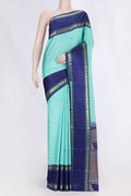Sea Green Dual Tone Kanchipuram Silk Saree with Checked design on the body and Zari And Thread Border displayed on a mannequin