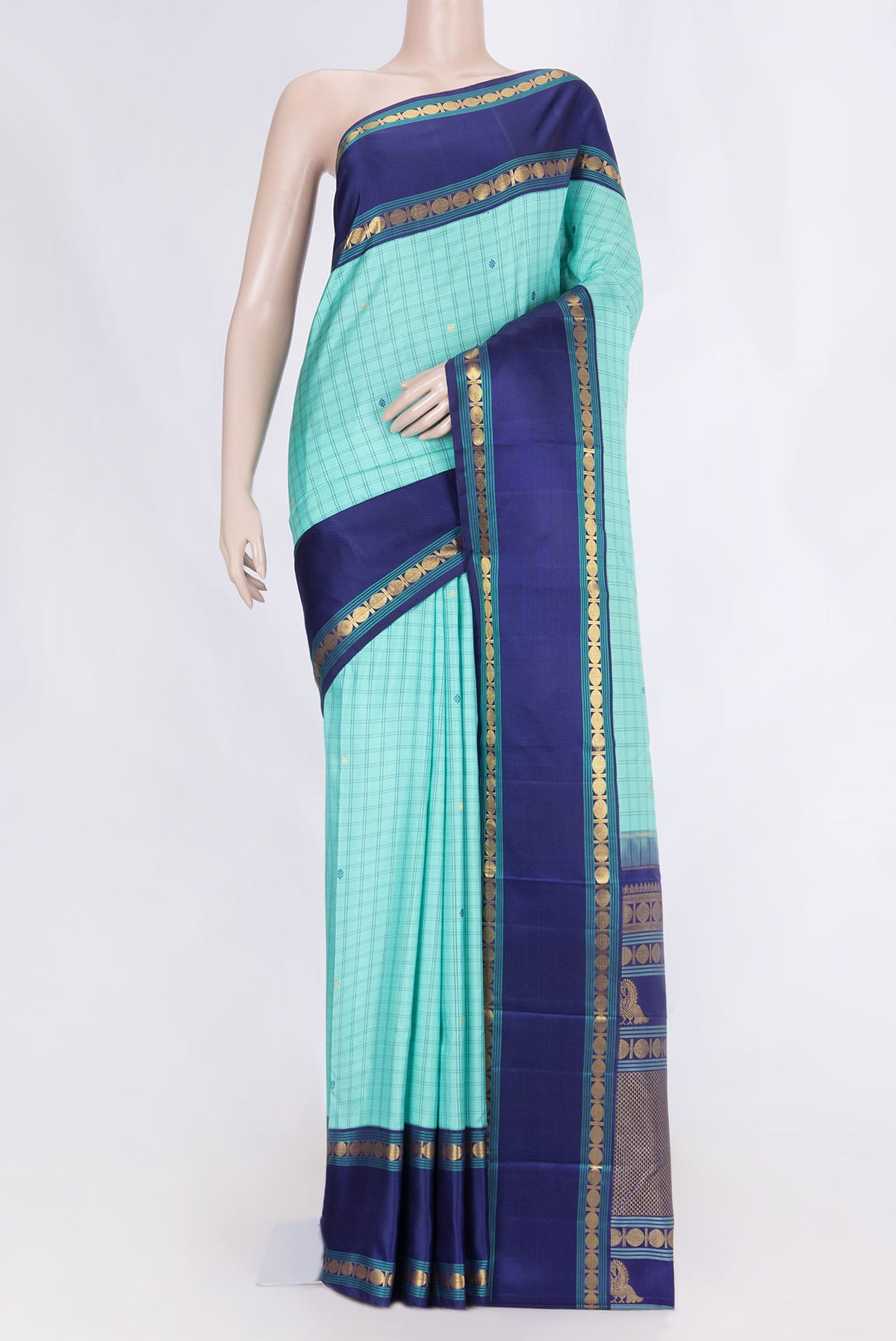 Sea Green Dual Tone Kanchipuram Silk Saree with Checked design on the body and Zari And Thread Border displayed on a mannequin
