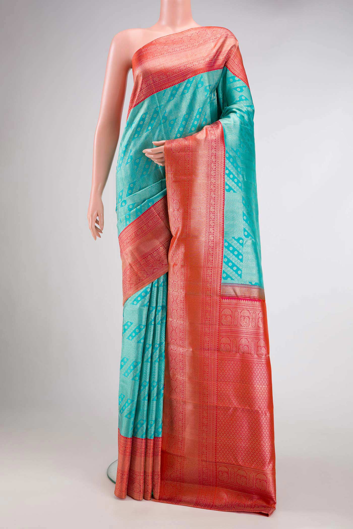 Sky Blue Dual Tone Kanchipuram Silk Saree with Zari Brocade on the body and Zari Border.  displayed on a mannequin