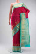 Pink Kanchipuram Silk Saree with Zari Butta on the body and Zari Border displayed on a mannequin