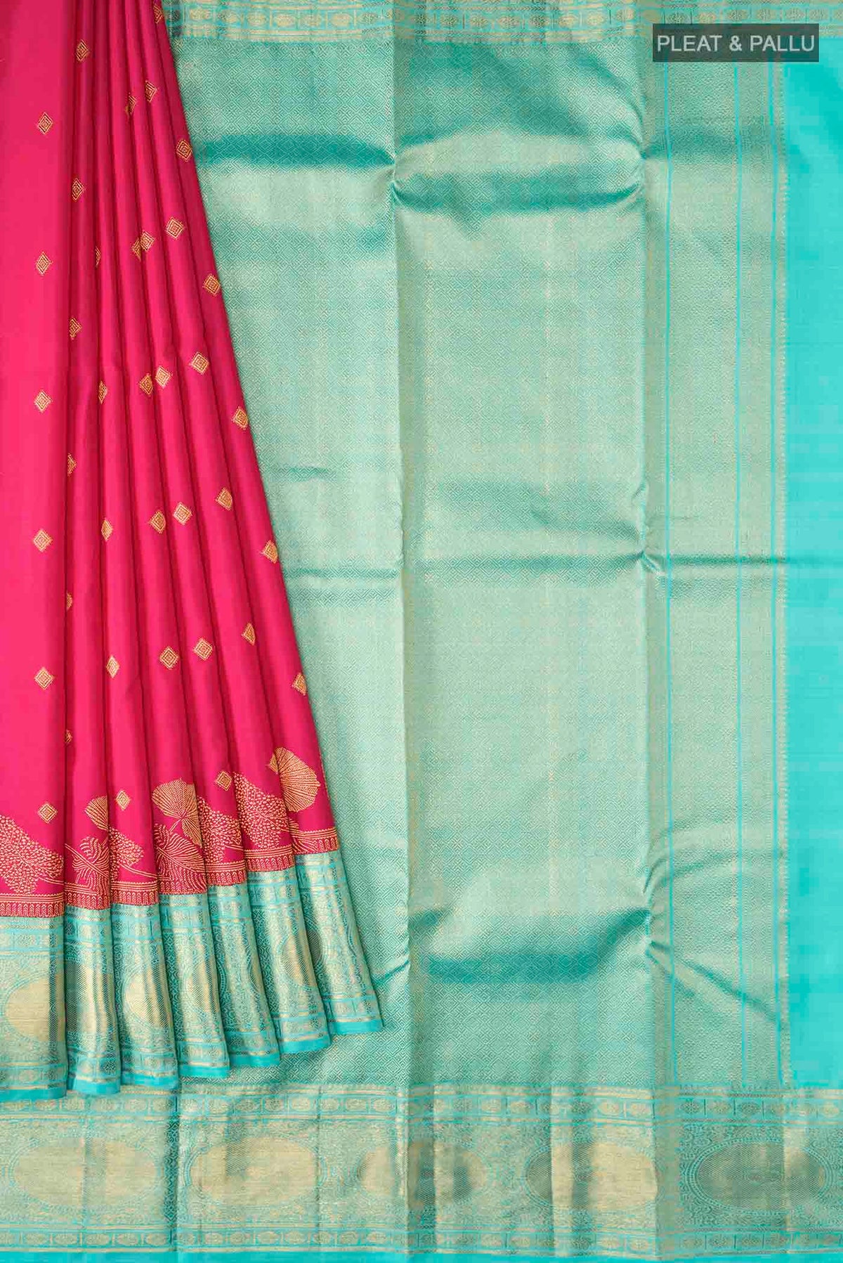 Pleats and pallu of Pink Kanchipuram Silk Saree with Zari Butta on the body and Zari Border