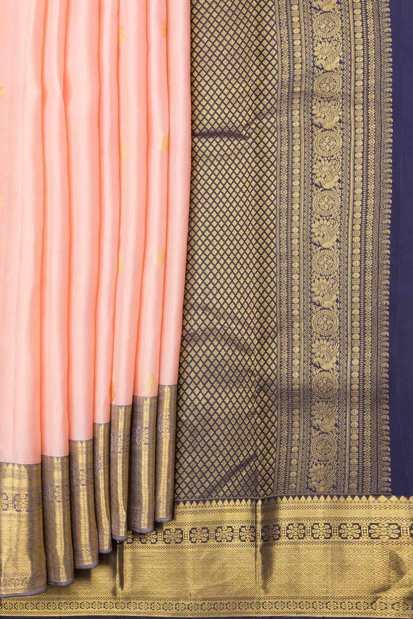 Pleats and pallu of Golden Peach Dual Tone Kanjivaram Saree with Zari Butta on the body and Zari Border. 