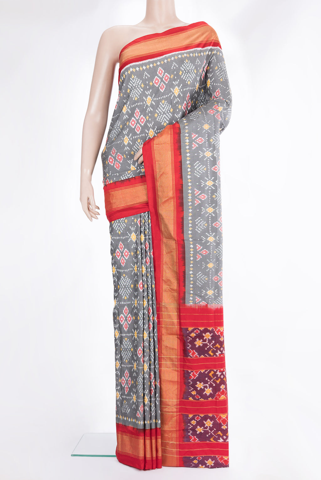 Pure Silk Grey Pochampally Saree with Ikat design on the body and Zari Border.  displayed on a mannequin