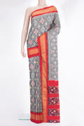 Pure Silk Grey Pochampally Saree with Ikat design on the body and Zari Border.  displayed on a mannequin