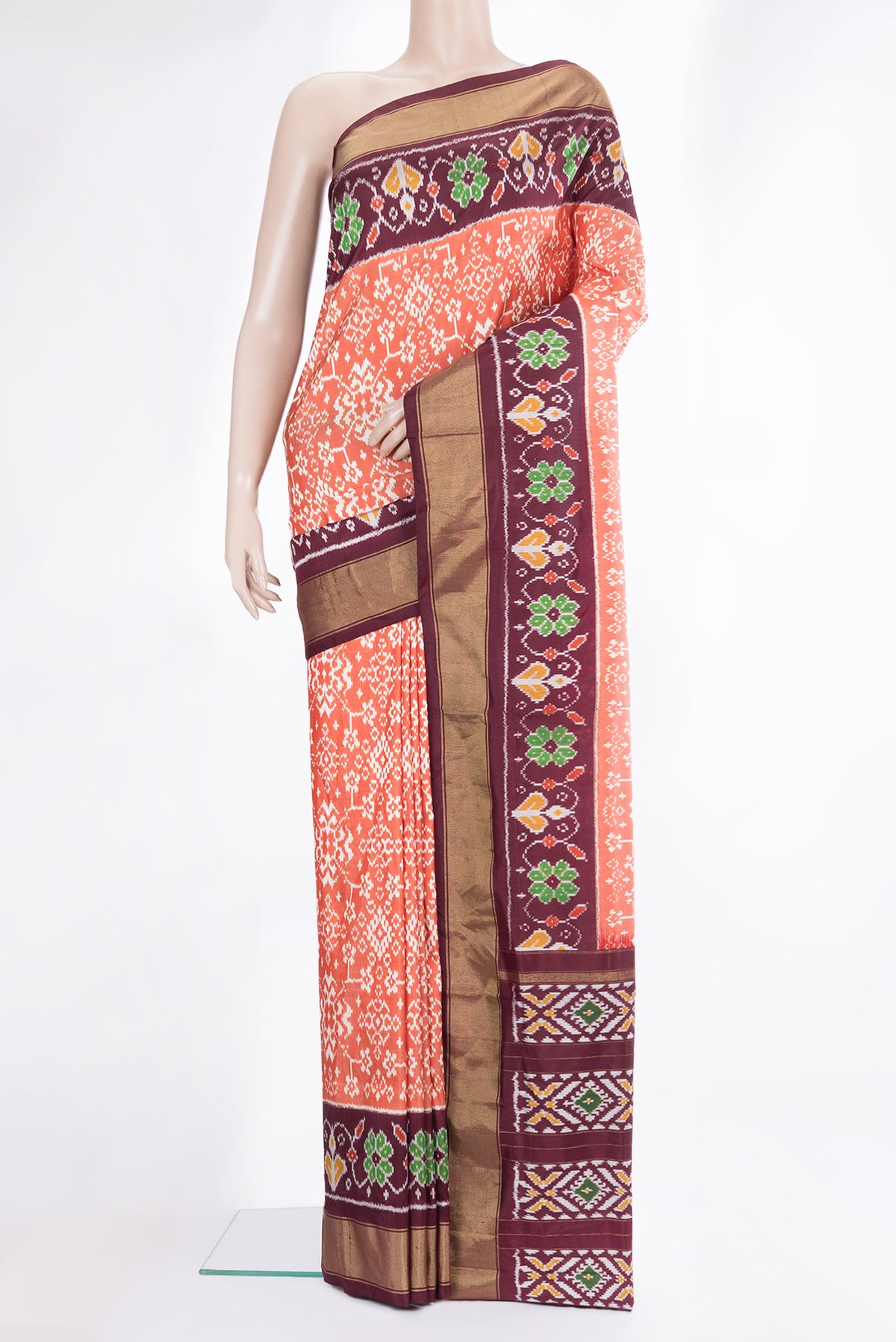 Pure Silk Rust Pochampally Saree with Ikat design on the body and Ikat Border.  displayed on a mannequin