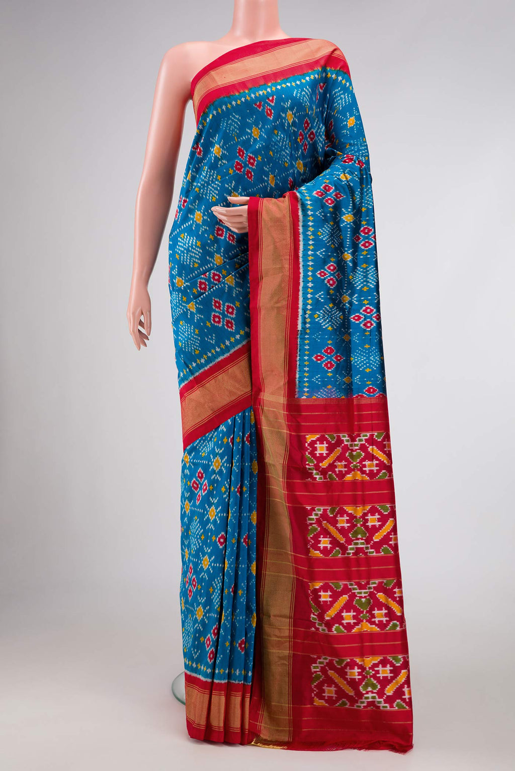 Blue Pochampally Silk Saree with Pure Ikat on the body and Zari Border displayed on a mannequin