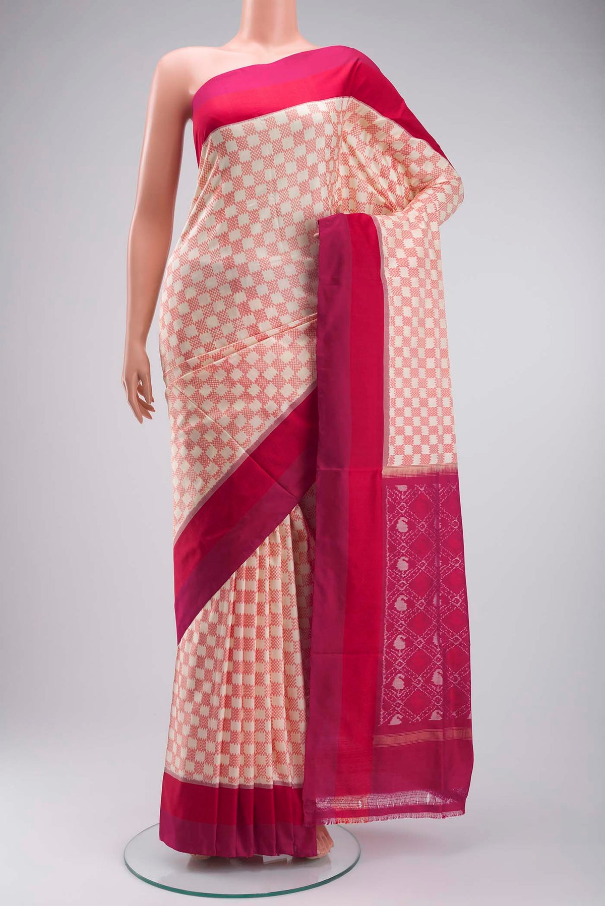Cream Pochampally Silk Saree with Pure Ikat on the body and Plain Border displayed on a mannequin