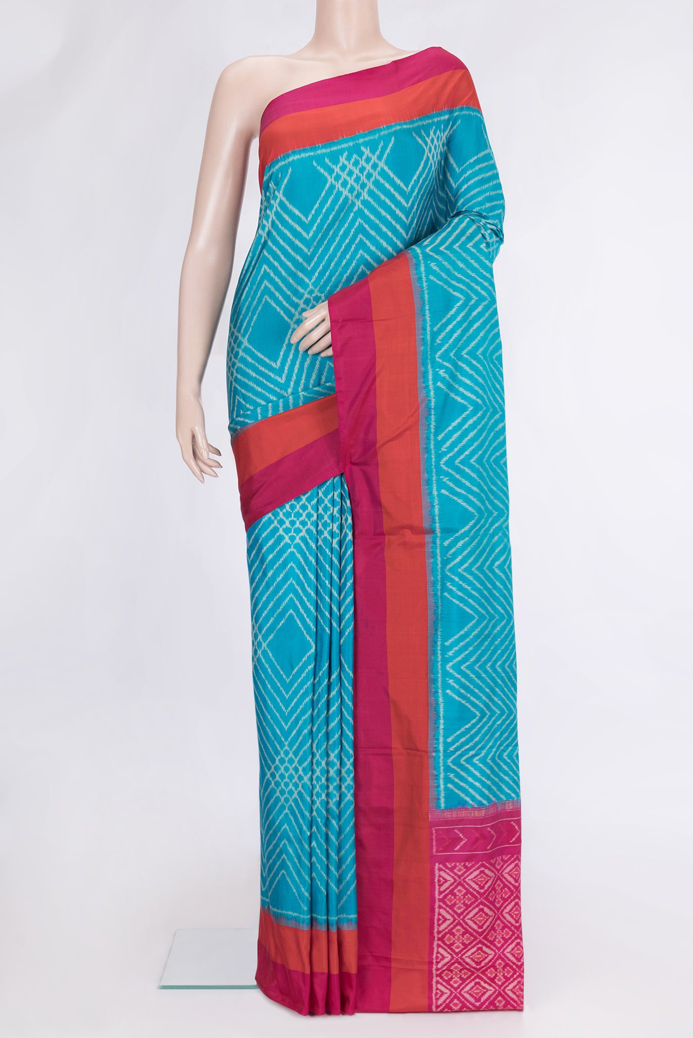 Sky Blue Dual Tone Double Ikat Saree with Ikat Print on the body and Plain Border.  displayed on a mannequin