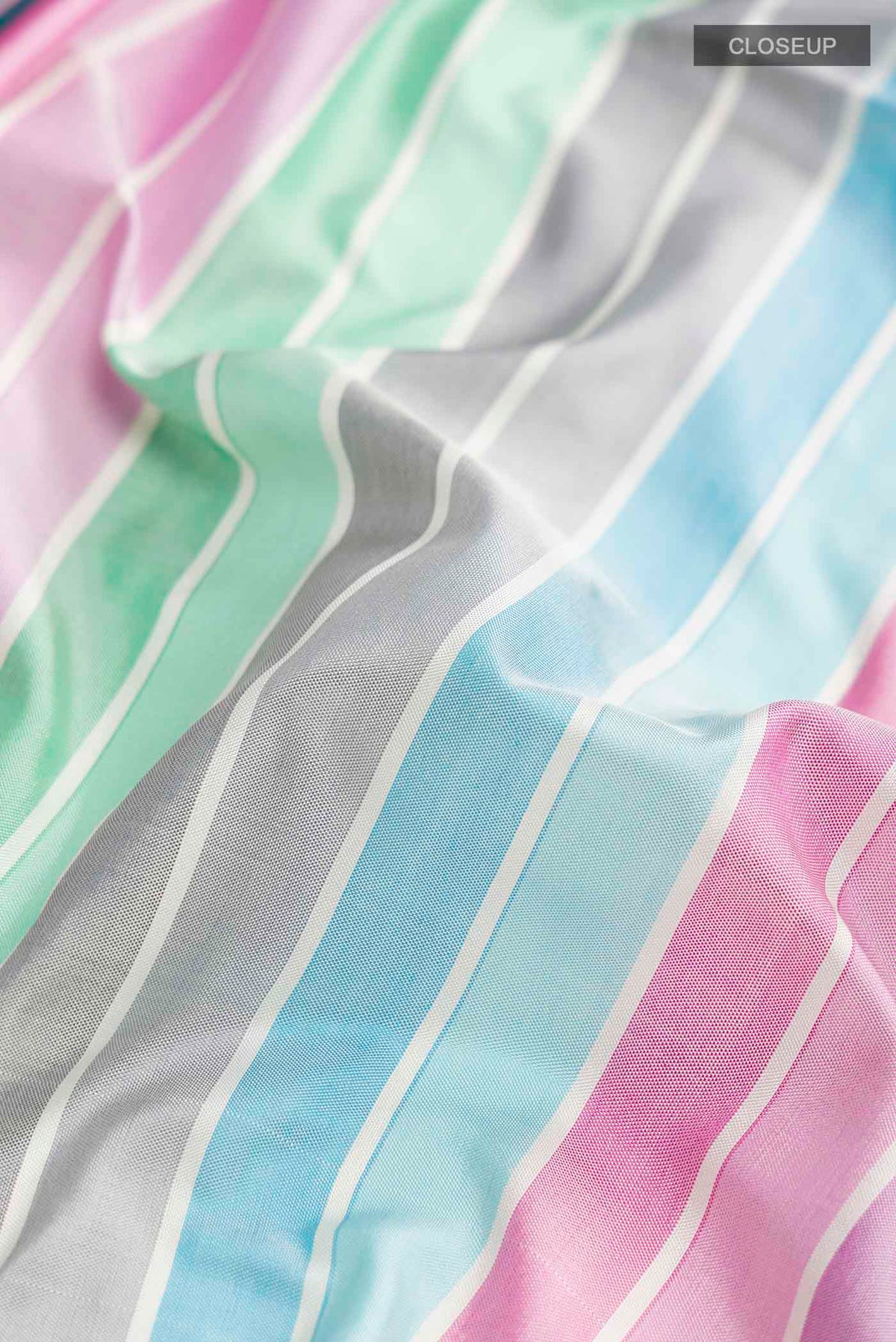 Close up of Multi Color Pochampally Silk Saree with Stripes on the body and Zari Border displaying folds