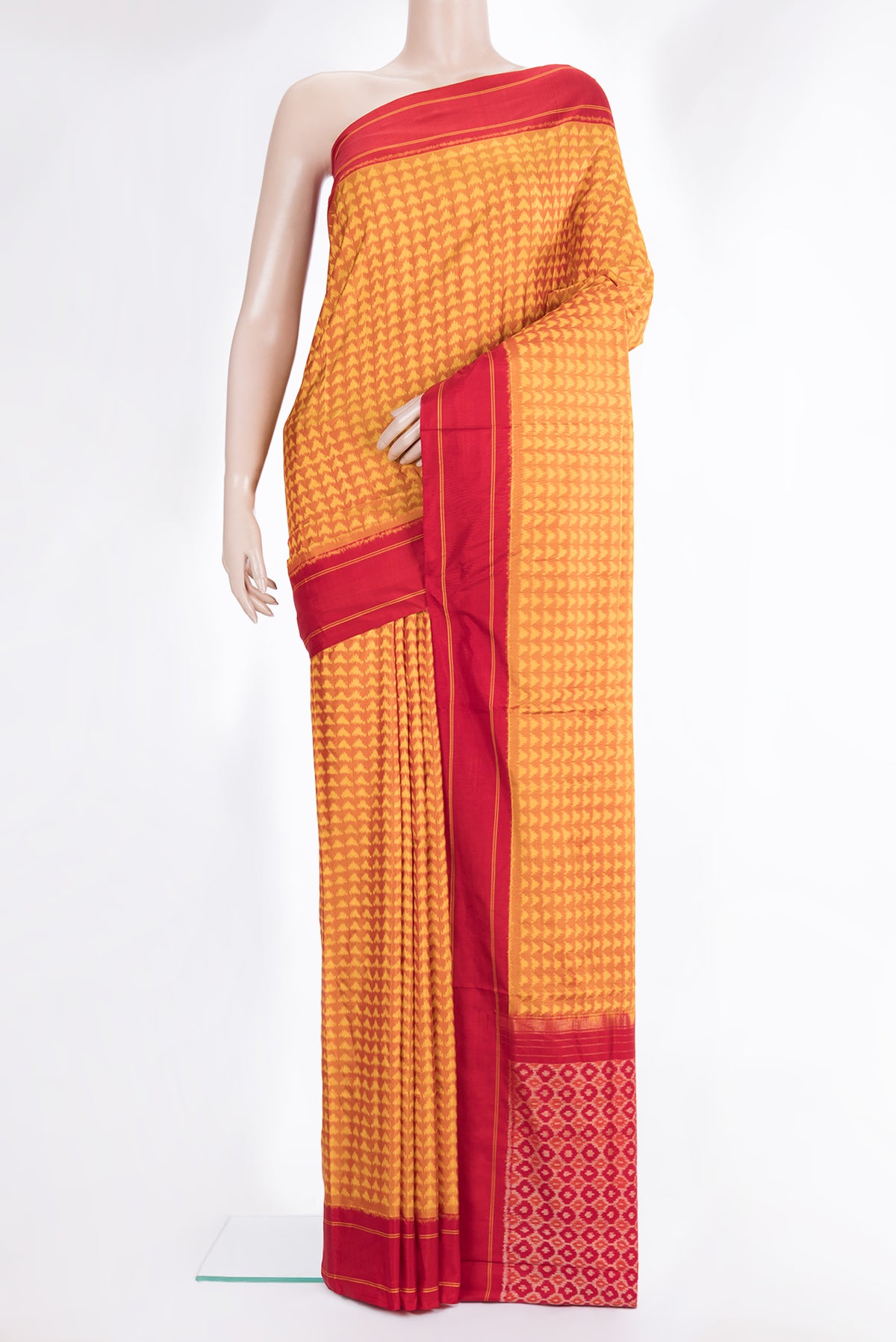 Pure Silk Mustard Pochampally Saree with Pure Ikat on the body and Plain Border.  displayed on a mannequin