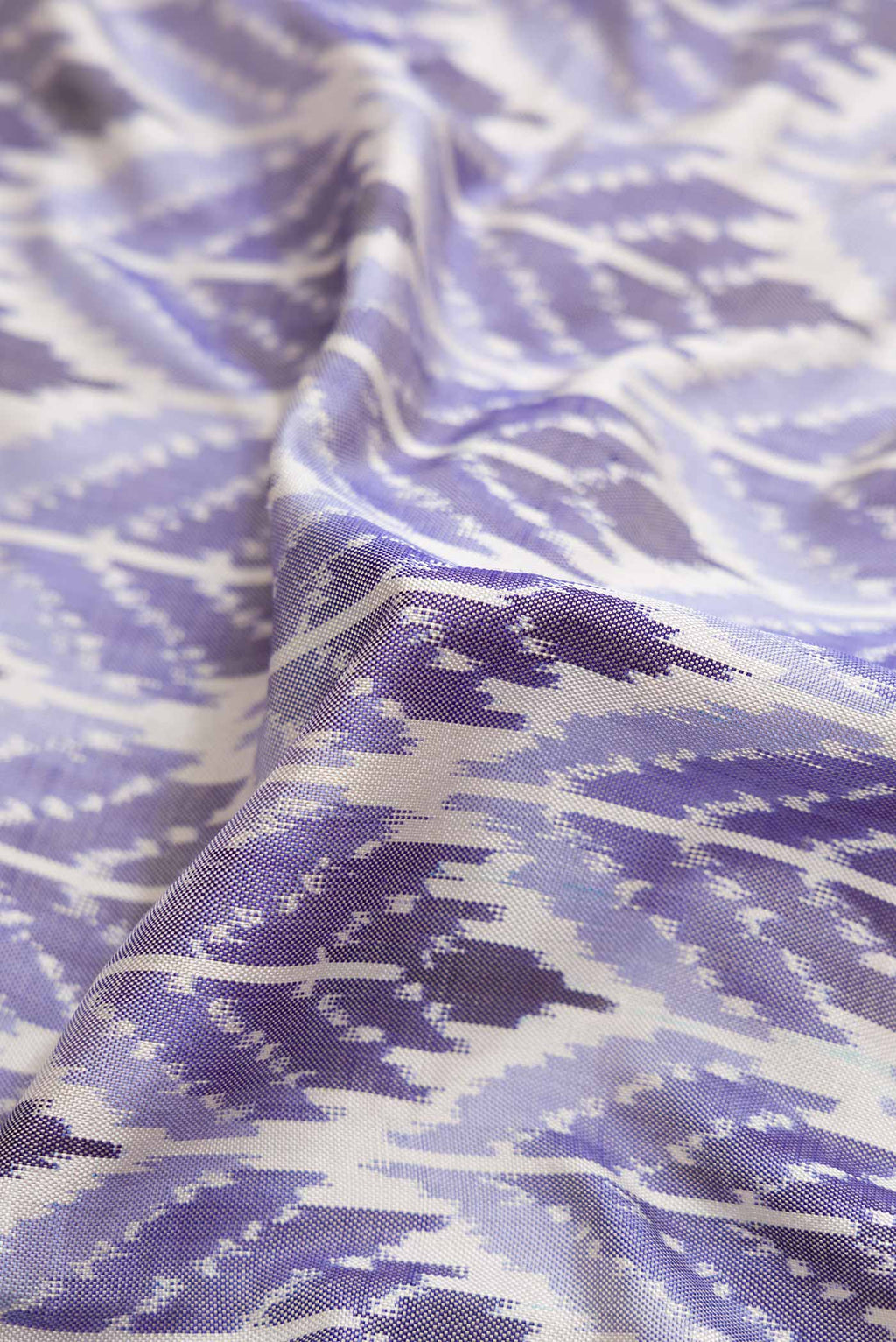 Close up of Multi Color Pochampally Silk Saree with Pure Ikat on the body and Plain Border displaying folds