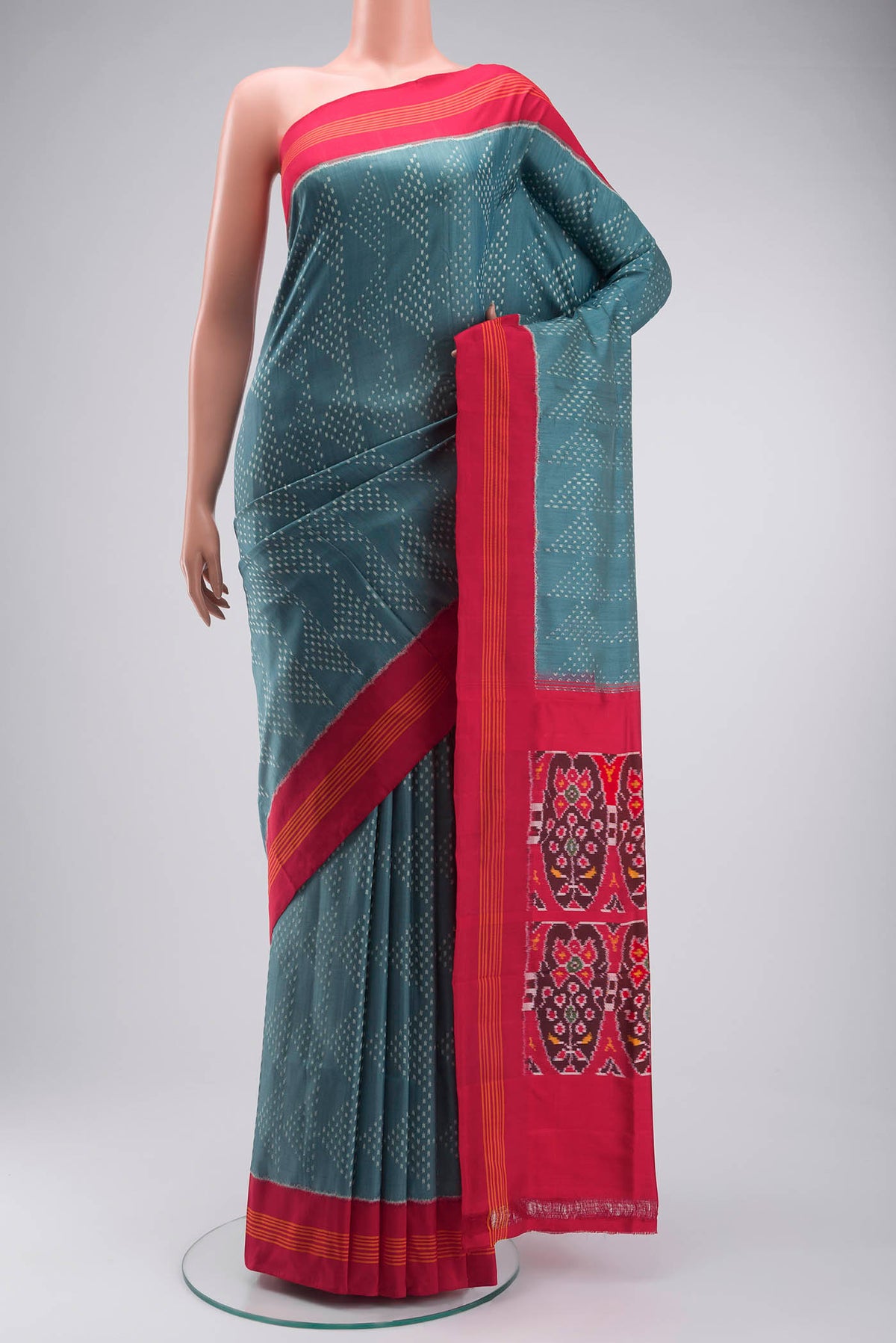 Grey Pochampally Silk Saree with Pure Ikat on the body and Plain Border displayed on a mannequin