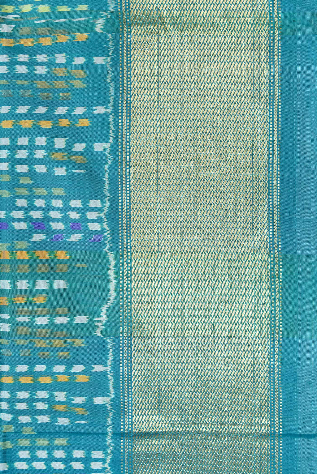 Border image of Peacock Blue Dual Tone Double Ikat Saree with Ikat Print on the body and Zari Border. 