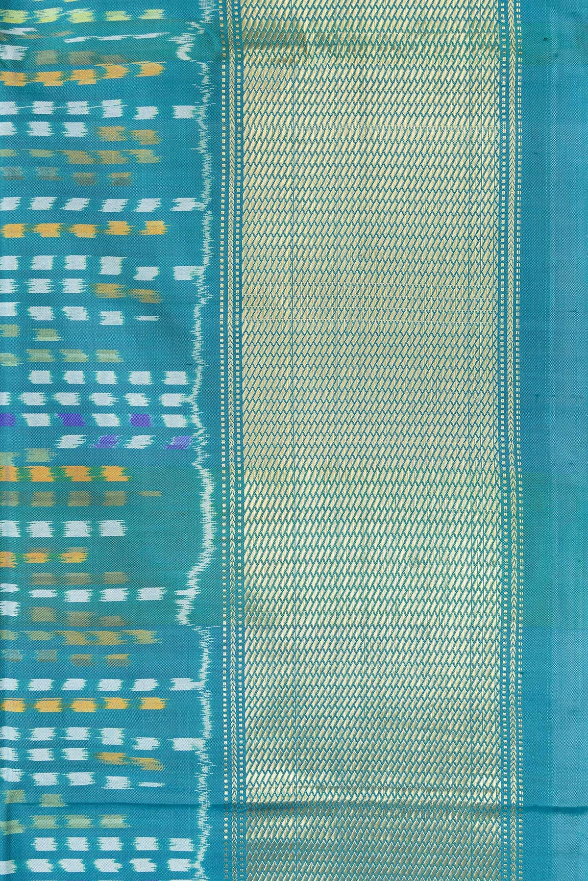 Border image of Peacock Blue Dual Tone Double Ikat Saree with Ikat Print on the body and Zari Border. 