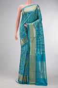 Peacock Blue Dual Tone Double Ikat Saree with Ikat Print on the body and Zari Border.  displayed on a mannequin