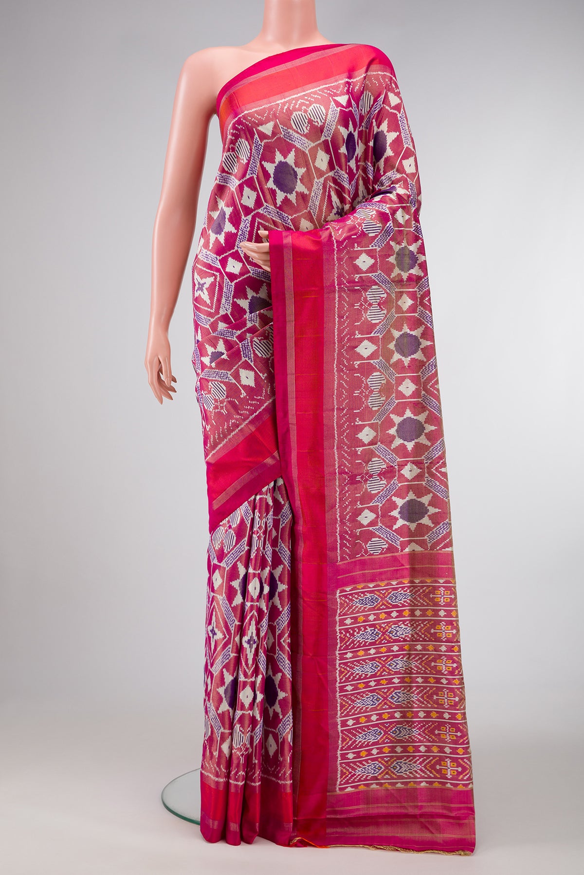 Pink Dual Tone Double Ikat Saree with Ikat Print on the body and Zari Border.  displayed on a mannequin