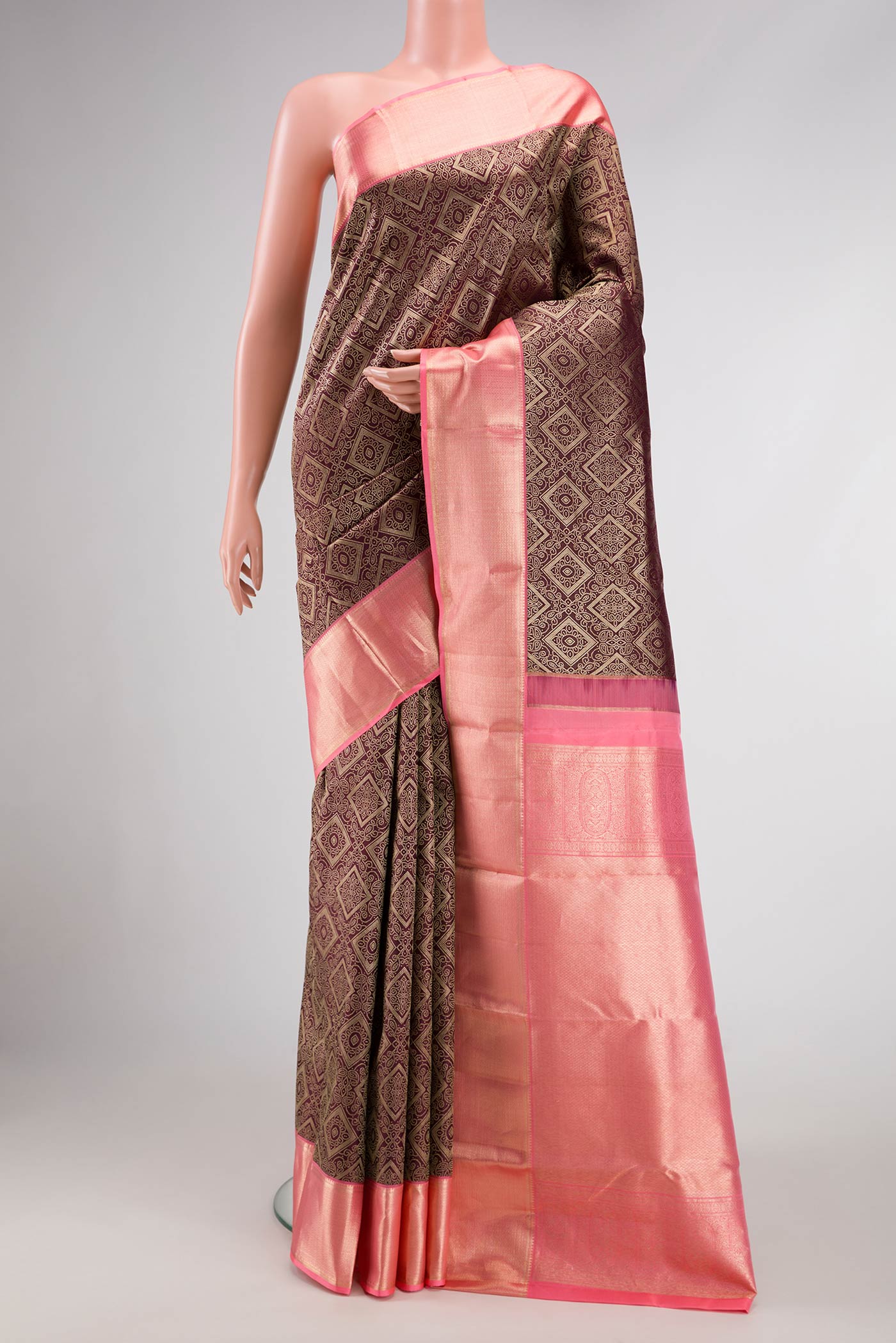 Coffee Brown Dual Tone Kanchipuram Silk Saree with Zari Brocade on the body and Zari Border.  displayed on a mannequin