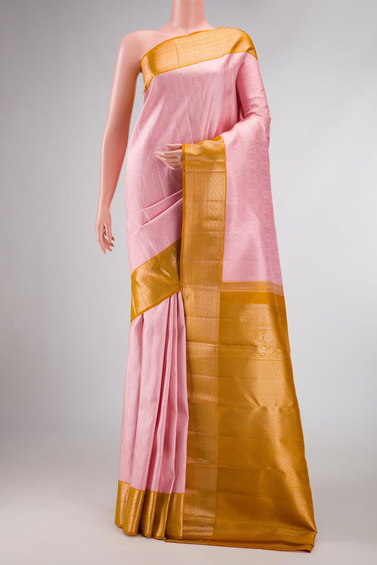 Rose pink Dual Tone Kanchipuram Silk Saree with Zari Brocade on the body and Zari Border displayed on a mannequin