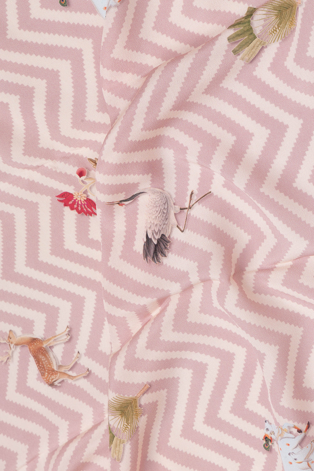 Close up of Rose Gold Dual Tone Mysore Crepe Saree with Printed design on the body and Printed Border.  displaying folds