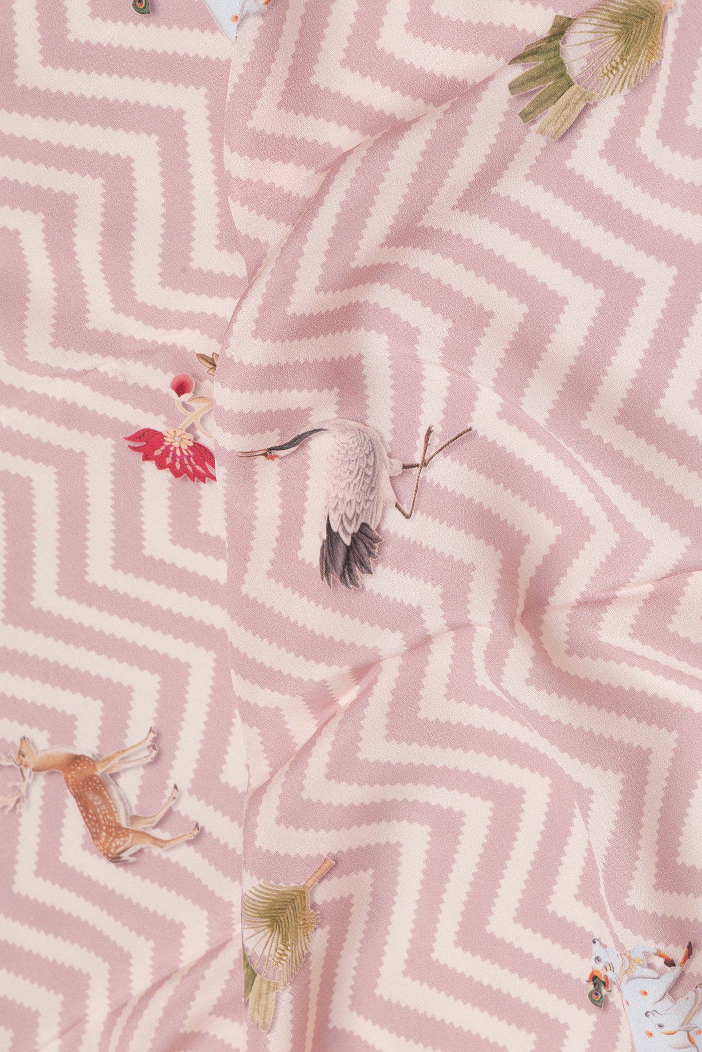 Close up of Rose Gold Dual Tone Mysore Crepe Saree with Printed design on the body and Printed Border.  displaying folds