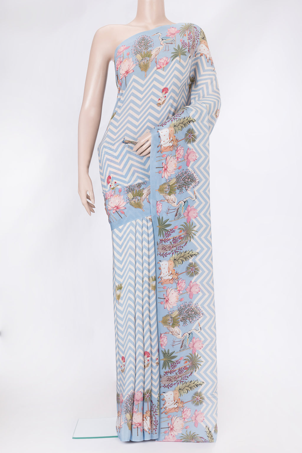 Light Blue Dual Tone Mysore Crepe Saree with Printed design on the body and Without Border.  displayed on a mannequin