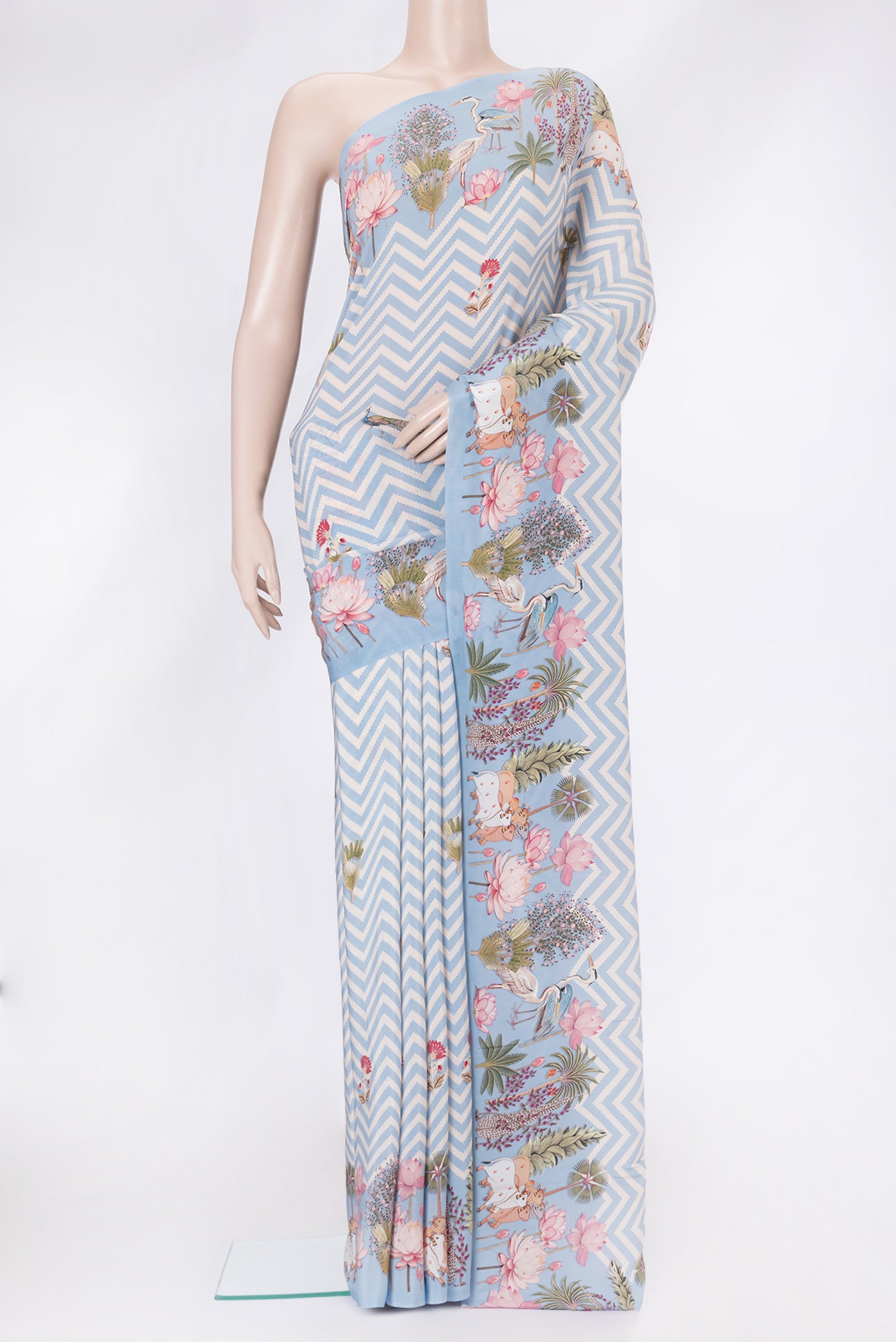 Light Blue Dual Tone Mysore Crepe Saree with Printed design on the body and Without Border.  displayed on a mannequin